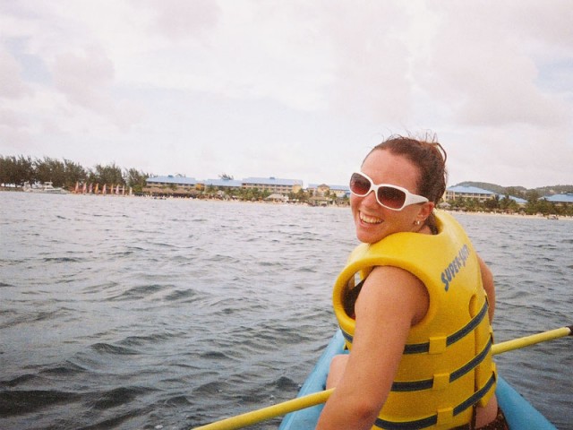 Kari kayaking with our resort in the background
