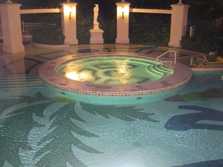 A hot tub and surrounding pool