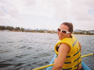 Kari kayaking with our resort in the background