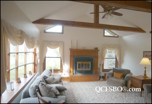 The living room hasn't changed a bit.  Dad made the mantle, we put that carpet in, mom made those curtains.  I think those are even our old couches.
