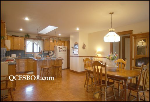 The kitchen - still the exact same - except different wallpaper.