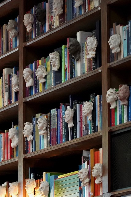 Little faces in the books at Livraria Lello