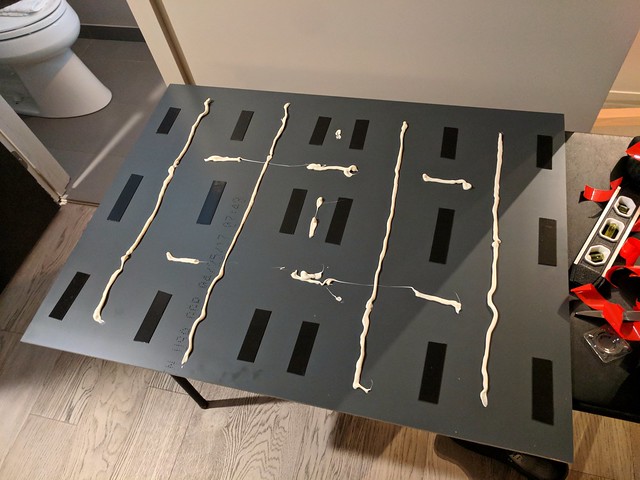 Bout to hang this mirror with no hardware... I have no idea if this is overkill or not.