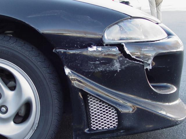 My front bumper and fender after being backed into