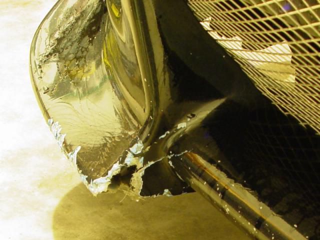 A chunk gone after the mechanic hit a curb and the lady in the Intrepid hit me