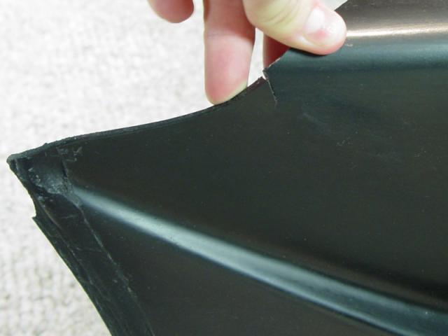 A crack underneath the missing chunk on the urethane bumper