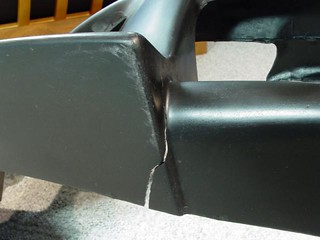 Broken - A huge tear underneath the passenger side of the bumper
