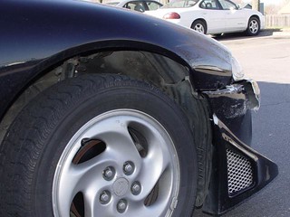Broken - My front bumper and fender after being backed into