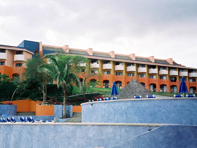 2 Levels of pools and hotels in the background