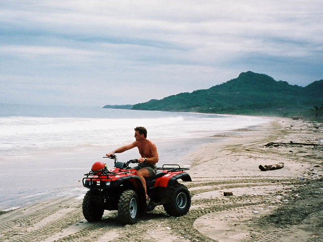 Dad riding around the beach