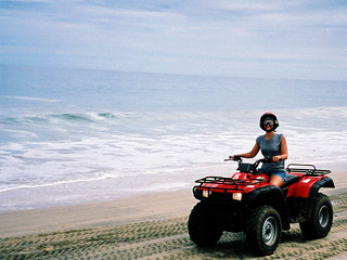 Bre'anna riding down a beach