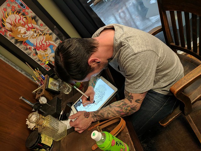 Joshua sketching up my next tattoo.