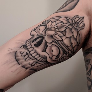 Tattoo - Healed tibetan skull on my inner bicep.
