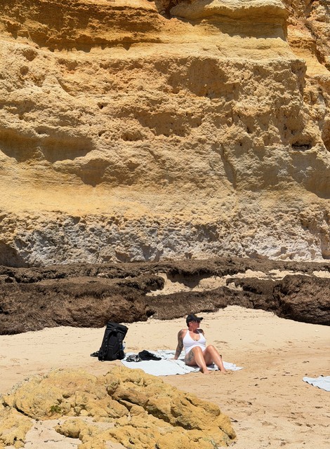 Kari was not about this beach. Those are all giant seaweed cakes behind her.