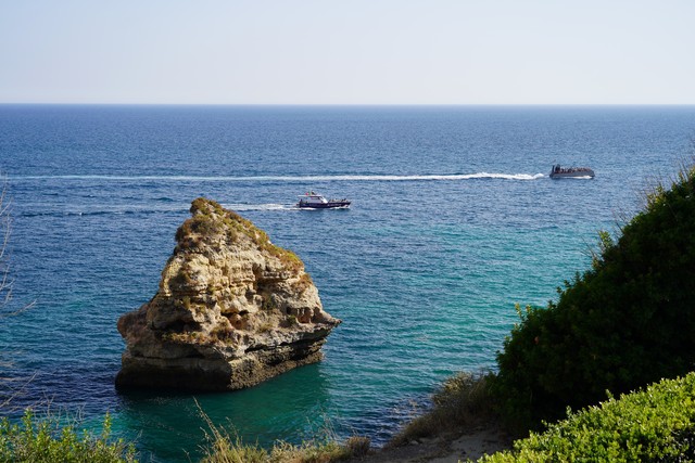 Boats cruise by the resort