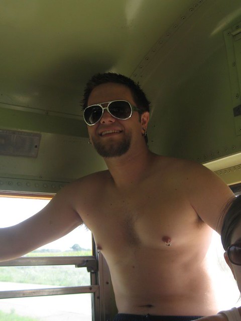 Sitting on some coolers in the bus