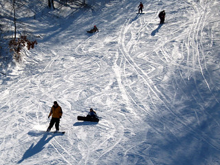 Snowboarding - Zach carving past Amy