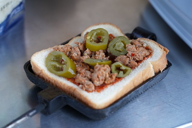 Makin a pie Iron sausage and jalapeno pizza