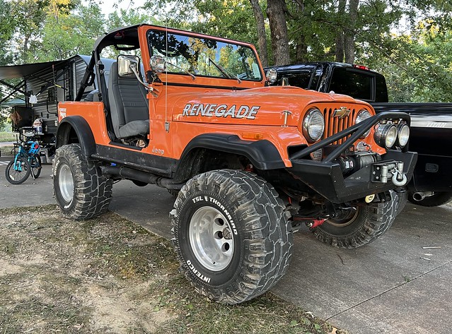 CJ5 Jeep Renegade with the chevy bowtie and side exit exhaust.