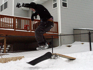 Snowboarding - Zach with a shove-it