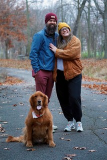 A happy couple and a happy dog