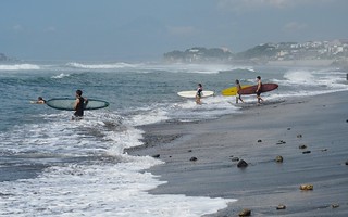 Surfers at the beach by our hotel