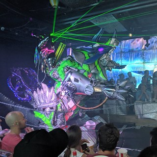 Crazy robot riding a robot triceratops dude