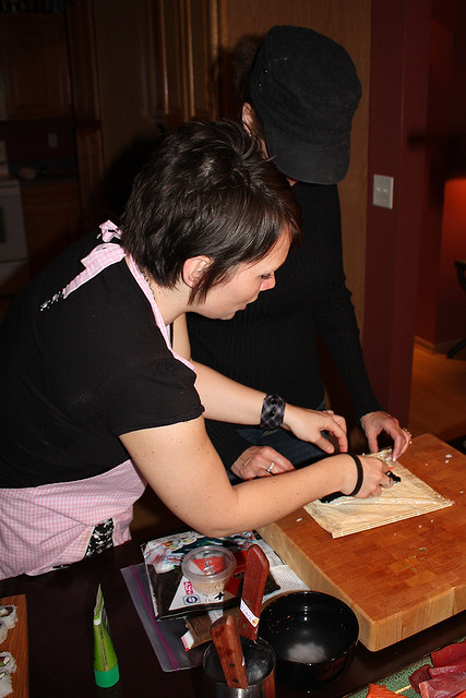 Helping mom roll sushi