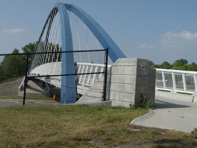 This sweet bridge connects some ghetto apartments on one side of the interstate to the ghetto apartments on the other.  But the sidewalk also just ended...