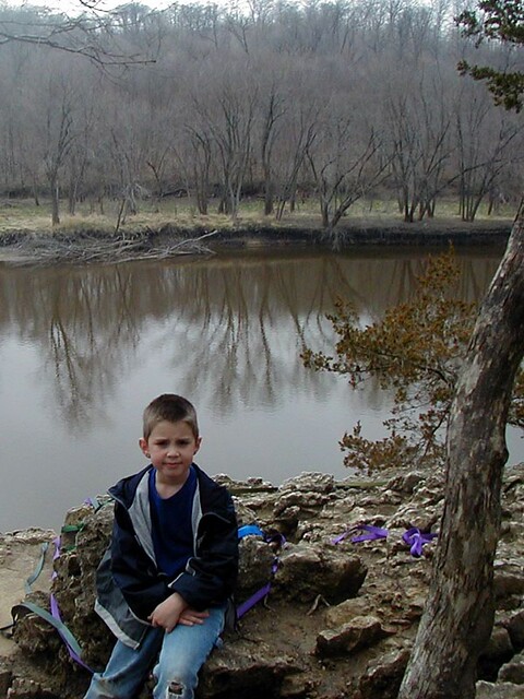 Ethan sitting on some repellers' anchor rock
