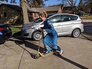 Elizabeth decides to try the scooter with heels and a dress on
