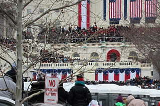 Politics - The president (that tiny man above the dude with the turquoise hoodie) speaks to us