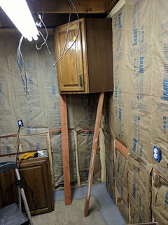 How to hang cabinets by yourself