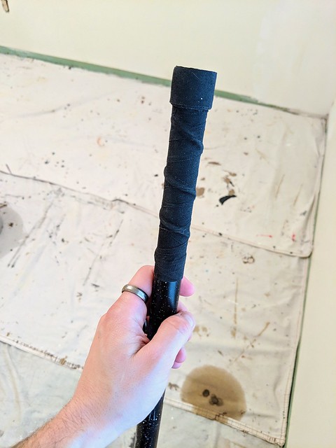 My aunt's paint stick had a sharp, metal end so I hockey wrapped it.
