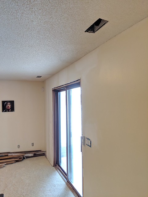 Holes patched from adding support for the wall we knocked out upstairs