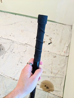 Hockey - My aunt's paint stick had a sharp, metal end so I hockey wrapped it.