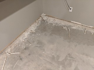 I cut 5/8" of drywall off the bottom of the drywall so that the floating floor could expand/contr...
