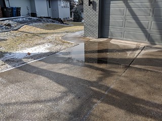 Puddling on the side of the driveway