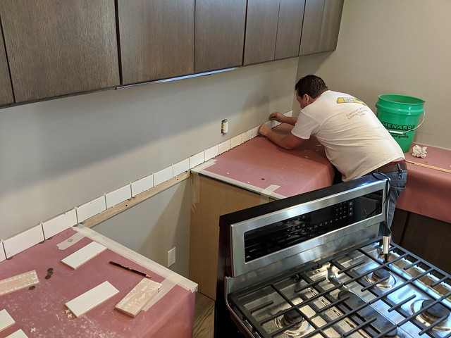 My friend, Artie brought over his tile saw and helped me set the tile