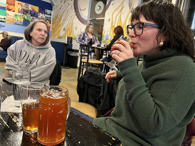 They had this beer that had tomato pulp in it. The first one was pretty clear. Kari told them to make a bloody beer out of it... so they shook the keg and brought her pints of more pulpy stuff to sample.