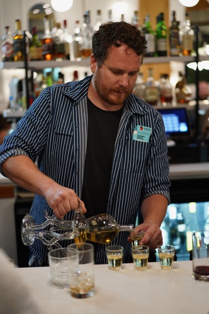 Klaus pouring out the octopus whiskey