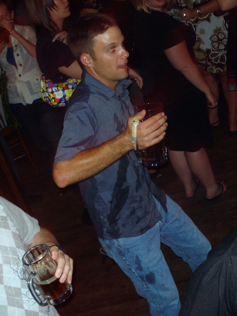 Tom needs to drink more of his beer before he dances so hard