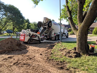 Loadin up the bobcat with concrete