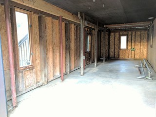 The awkward "shed" is cleaned out to make way for a covered patio.