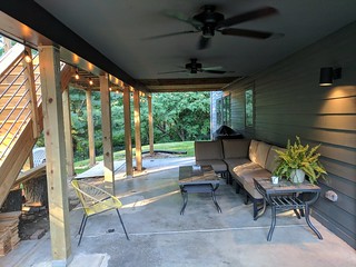 This area below our dining room and deck used to be a makeshift boat storage shed... I've still g...
