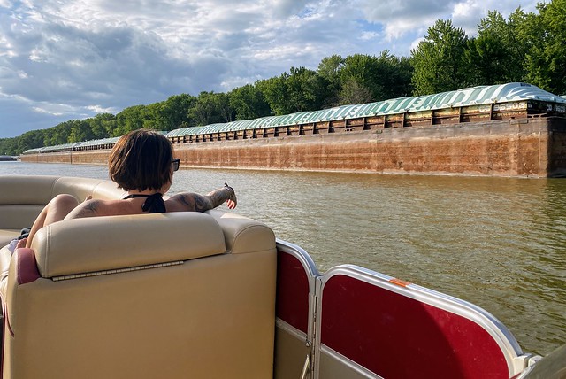 Boatin past this empty barge