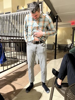 Josh tries on Jeff's jeans