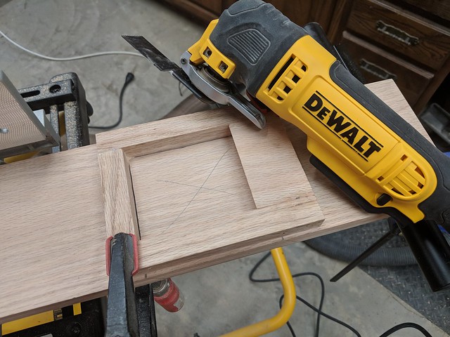 Once my newel post hole jig was made, I used a combination of a multi-tool, Japanese pull saw and chisels to cut it out.