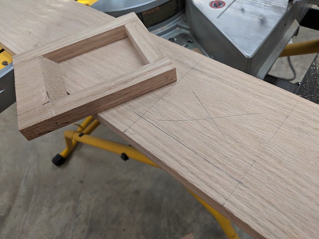 I made a jig in order to help me make a clean, square hole to inset the bottom newel post into the curb.