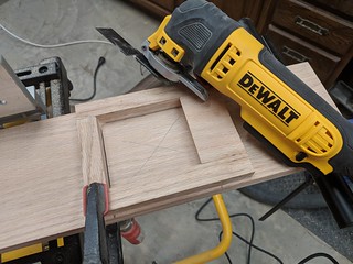 Once my newel post hole jig was made, I used a combination of a multi-tool, Japanese pull saw and...